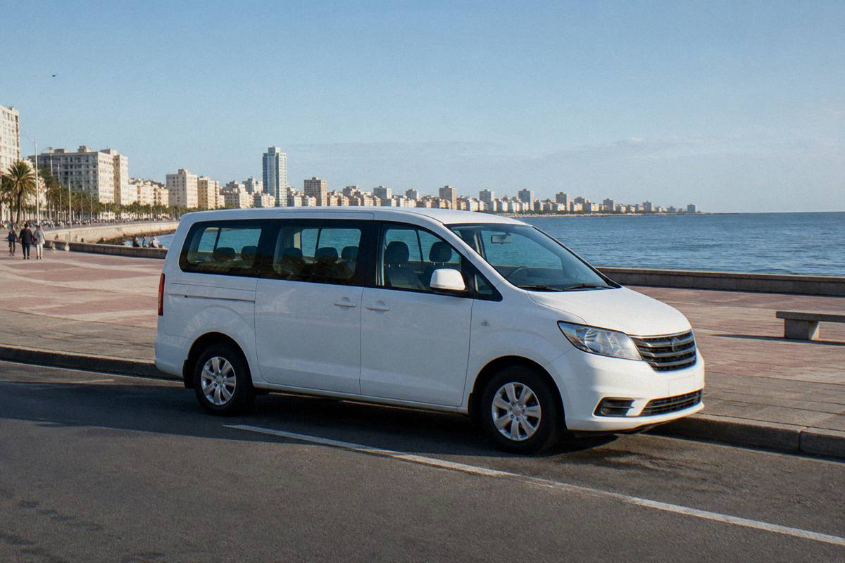 A tour minivan parked beside the Rambla in Montevideo